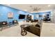 Spacious game room with sectional sofa and large TV at 2477 Shanti Dr, Kissimmee, FL 34746