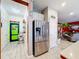 Game room with access to Personal cave and stainless steel refrigerator at 2477 Shanti Dr, Kissimmee, FL 34746