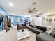 Spacious game room with sectional sofa and large TV at 2477 Shanti Dr, Kissimmee, FL 34746