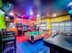 Entertaining game room with air hockey, pool table and arcade games at 2477 Shanti Dr, Kissimmee, FL 34746