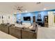 Spacious game room with sectional sofa and large TV at 2477 Shanti Dr, Kissimmee, FL 34746