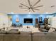 Spacious game room with sectional sofa and large TV at 2477 Shanti Dr, Kissimmee, FL 34746