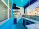 Outdoor kitchen with bar, beverage fridge, and TV at 2477 Shanti Dr, Kissimmee, FL 34746