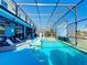 Enjoy this large pool and spa with outdoor movie screen at 2477 Shanti Dr, Kissimmee, FL 34746