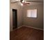 Bedroom with wood-look flooring, a closet, and a ceiling fan at 2860 N Powers Dr # 8, Orlando, FL 32818