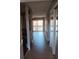 Bright and spacious entryway with wood-look flooring and mirrored closet doors at 2860 N Powers Dr # 8, Orlando, FL 32818