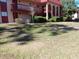 Exterior view of condo building with grassy lawn at 2860 N Powers Dr # 8, Orlando, FL 32818