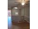 Open living room with a unique partial wall and wood-look flooring at 2860 N Powers Dr # 8, Orlando, FL 32818