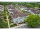 Aerial view of townhouses with well-maintained landscaping at 5368 Diplomat Ct # 104, Kissimmee, FL 34746