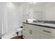 Bathroom with granite countertop and tub at 5368 Diplomat Ct # 104, Kissimmee, FL 34746