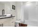 Clean bathroom with granite countertop, white tub, and shower at 5368 Diplomat Ct # 104, Kissimmee, FL 34746