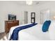 Main bedroom with king bed and dresser at 5368 Diplomat Ct # 104, Kissimmee, FL 34746