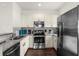 Modern kitchen with stainless steel appliances and granite countertops at 5368 Diplomat Ct # 104, Kissimmee, FL 34746