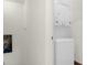 Stackable washer and dryer in a convenient laundry room at 5368 Diplomat Ct # 104, Kissimmee, FL 34746
