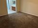 Spacious carpeted bedroom with ensuite bathroom access at 602 Mesilla Dr, Kissimmee, FL 34758