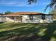 House exterior showcasing a screened patio and side yard at 602 Mesilla Dr, Kissimmee, FL 34758