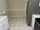 Bright kitchen with white cabinets and tiled floor at 602 Mesilla Dr, Kissimmee, FL 34758