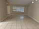 Spacious living room with neutral-colored tile flooring at 602 Mesilla Dr, Kissimmee, FL 34758