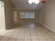 Large living room with tile flooring and vaulted ceilings at 602 Mesilla Dr, Kissimmee, FL 34758