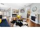 Spacious living area with hardwood floors, fireplace, and large windows at 698 Mt Pleasant Dr, Ocoee, FL 34761