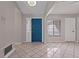 Bright entryway with teal door and tile flooring at 7393 Radiant Cir, Orlando, FL 32810