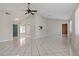 Bright and airy living room with tile floors and high ceilings at 7393 Radiant Cir, Orlando, FL 32810