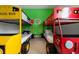 Fun bedroom with a school bus and firetruck bunk beds, adding a whimsical touch to the space at 7423 Sparkling Ct, Reunion, FL 34747