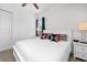 Bright bedroom with a king-size bed and white bedding at 7423 Sparkling Ct, Reunion, FL 34747