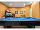 Game room with pool table and racing game for entertainment at 7423 Sparkling Ct, Reunion, FL 34747