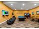 Game room featuring a pool table, arcade games, and beanbag chairs, perfect for entertainment at 7423 Sparkling Ct, Reunion, FL 34747