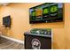 Golf arcade game with a large screen and intuitive controls for a fun, casual game at 7423 Sparkling Ct, Reunion, FL 34747
