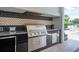 Stainless steel grill with built-in side burner at 7423 Sparkling Ct, Reunion, FL 34747