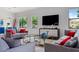 Spacious living room with sectional sofa and large TV at 7423 Sparkling Ct, Reunion, FL 34747
