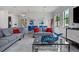 Modern living room with sectional sofa and large TV at 7423 Sparkling Ct, Reunion, FL 34747