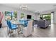 Open concept living and dining area with modern decor at 7423 Sparkling Ct, Reunion, FL 34747