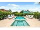 Inviting pool and spa area with multiple lounge chairs at 7423 Sparkling Ct, Reunion, FL 34747