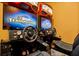 High-end NASCAR racing game with a large screen and realistic steering wheel and pedals at 7423 Sparkling Ct, Reunion, FL 34747