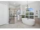 Spa-like bathroom with soaking tub, walk-in shower, and modern fixtures at 1000 Dunhurst Ct, Longwood, FL 32779