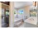 Elegant bathroom with a soaking tub and walk-in shower at 1321 Lakeview Dr, Winter Park, FL 32789