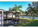 Screened-in patio with a tranquil pond view at 149 Springberry Ct, Daytona Beach, FL 32124