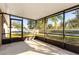 Screened-in patio overlooking the backyard and a pond at 149 Springberry Ct, Daytona Beach, FL 32124