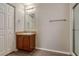 Bathroom with wood-look flooring, vanity sink, and shower at 149 Springberry Ct, Daytona Beach, FL 32124