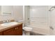 Simple bathroom with shower/tub combo and wood vanity at 149 Springberry Ct, Daytona Beach, FL 32124