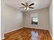 Comfortable bedroom with laminate wood flooring, a ceiling fan, and ample natural light at 149 Springberry Ct, Daytona Beach, FL 32124