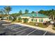 Community center with playground, parking, and American flag at 149 Springberry Ct, Daytona Beach, FL 32124