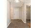 Inviting foyer with wood-look flooring, neutral walls, and a white six-panel door at 149 Springberry Ct, Daytona Beach, FL 32124
