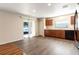 Bright kitchen with wood cabinets, black appliances, and sliding glass doors leading to the outdoors at 149 Springberry Ct, Daytona Beach, FL 32124