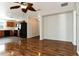 Open living area with wood-look flooring, neutral walls, and a glimpse of the kitchen at 149 Springberry Ct, Daytona Beach, FL 32124