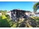 Spacious covered patio on the back of a house at 149 Springberry Ct, Daytona Beach, FL 32124