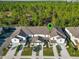 Aerial view of a townhome community showing location and surrounding landscape at 1592 Wynford Cir, Tavares, FL 32778